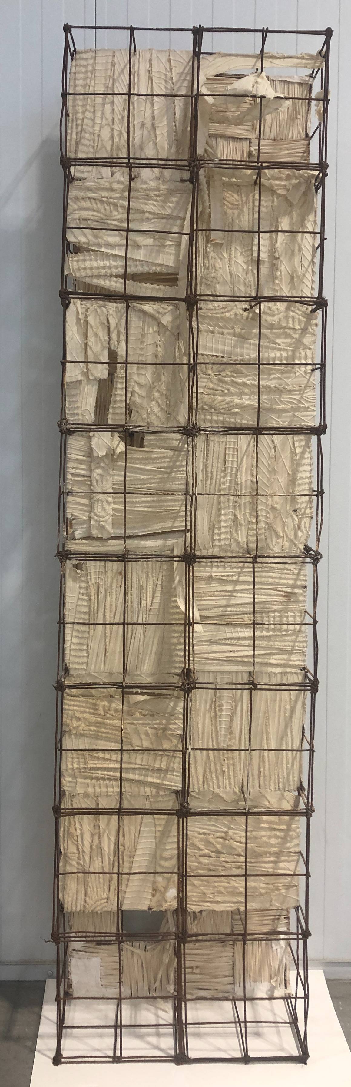 metal scaffold with handmade paper hanging from interior wires